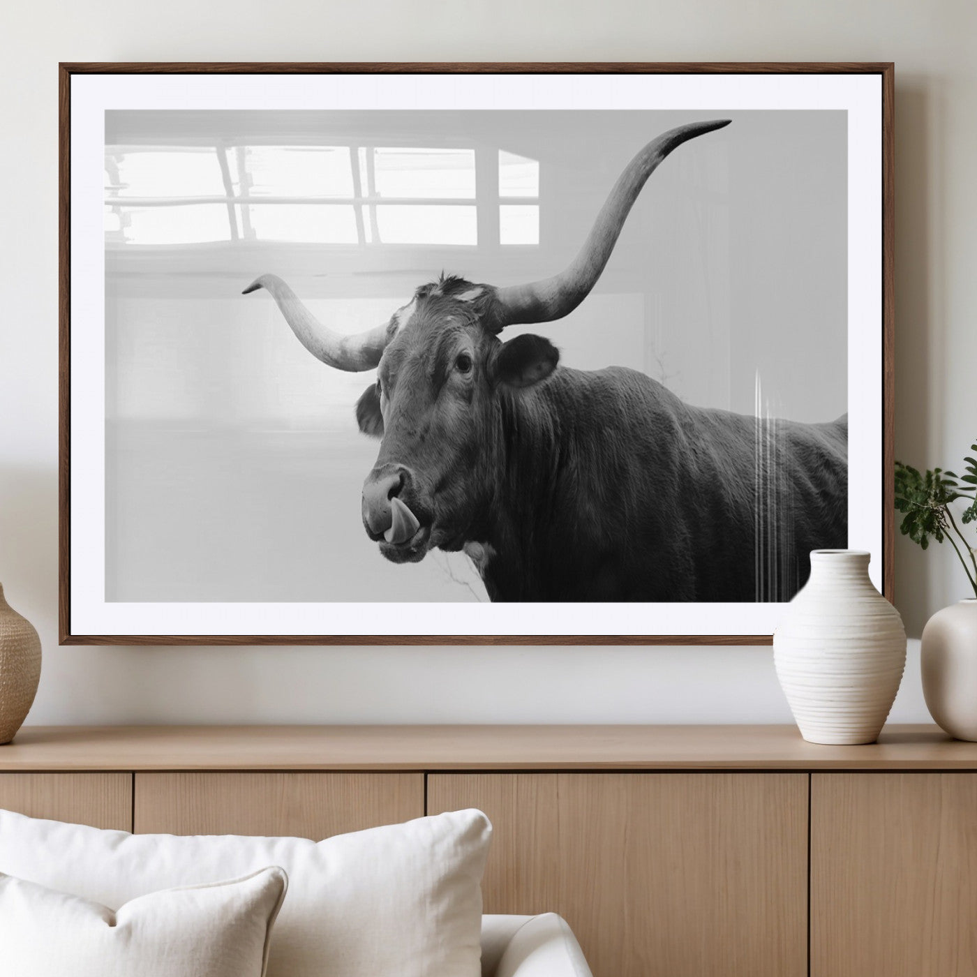 Black and white photo of a Texas Longhorn cow with curved horns, ideal for rustic, western or minimalist style home decor.