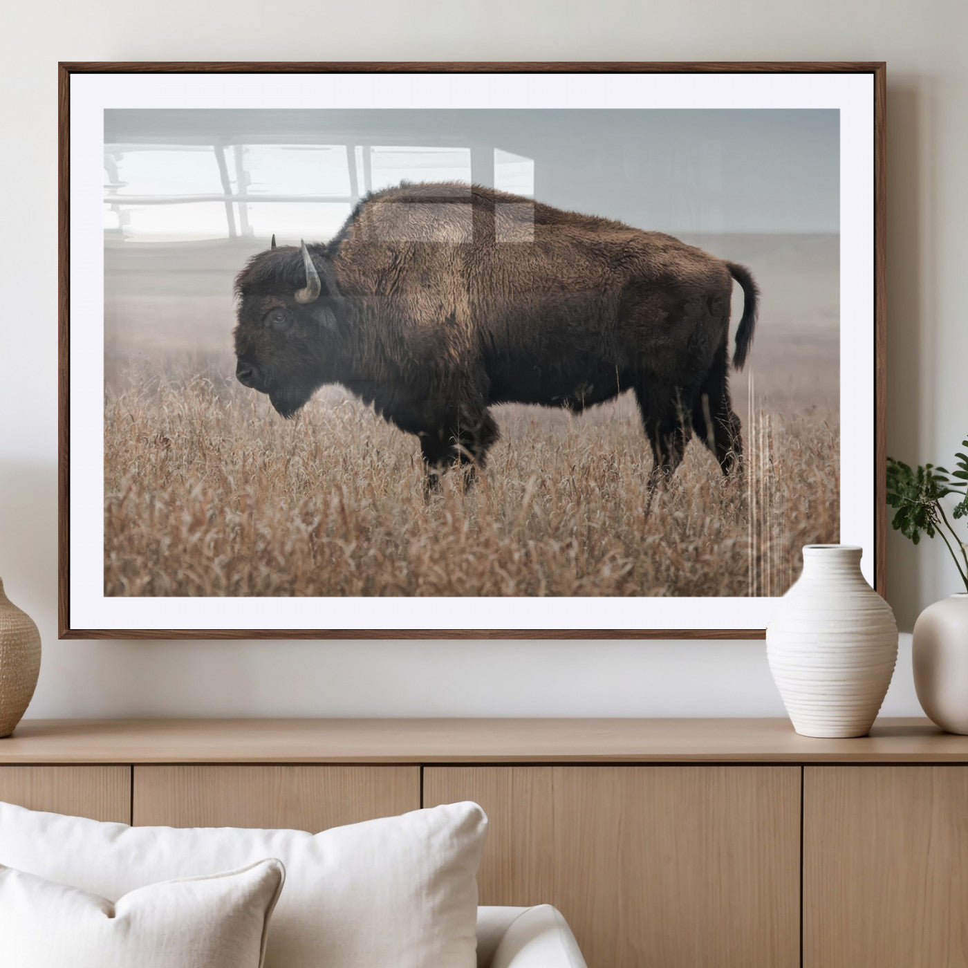 A lone bison stands in a vast prairie under a soft sky, evoking freedom and rustic charm for western or farmhouse inspired interiors.