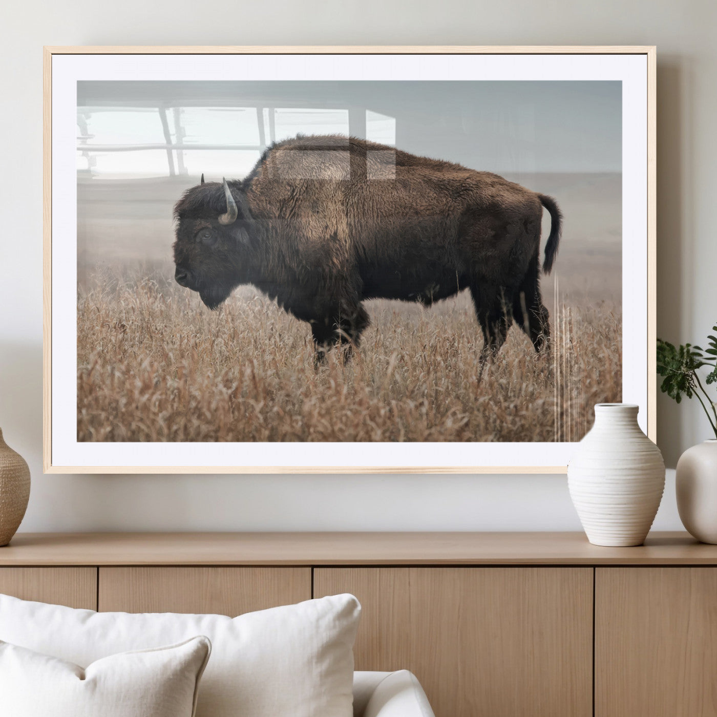 A lone bison stands in a vast prairie under a soft sky, evoking freedom and rustic charm for western or farmhouse inspired interiors.