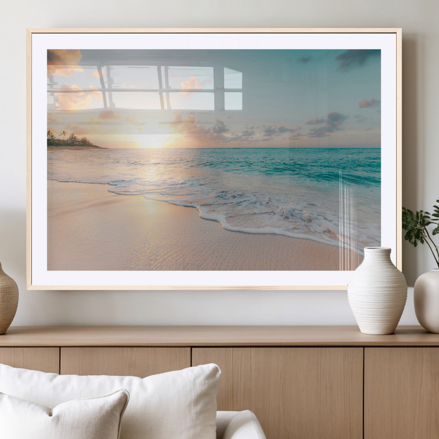 Golden sunset over a tropical beach with gentle ocean waves and soft white sand, creating a peaceful and relaxing coastal scene.