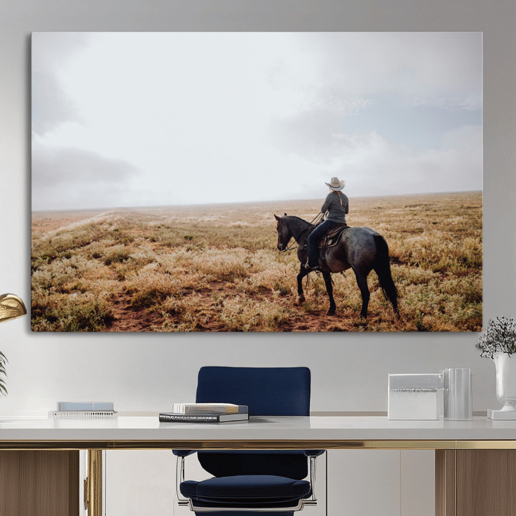A lone cowboy riding horseback across an open prairie under a vast sky, capturing the rugged and timeless spirit of the Western frontier.