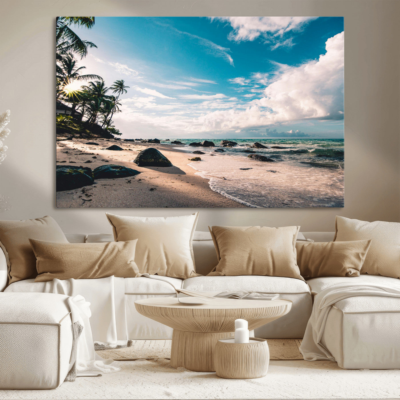 Scenic tropical beach with palm trees, ocean waves, and rocky shoreline under a bright blue sky, creating a serene coastal vibe.