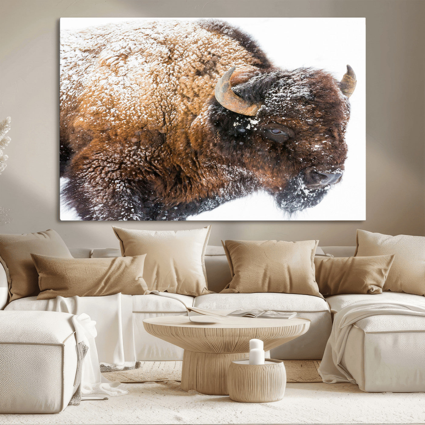 Close-up photograph of a bison covered in snow, highlighting its thick fur and powerful presence, set against a white winter backdrop, ideal for rustic decor.