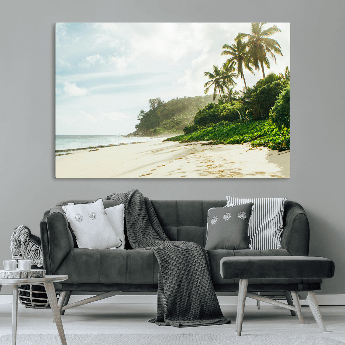 A tropical beach with palm trees, soft sand, and ocean waves under a bright sky, creating a peaceful and relaxing coastal view.