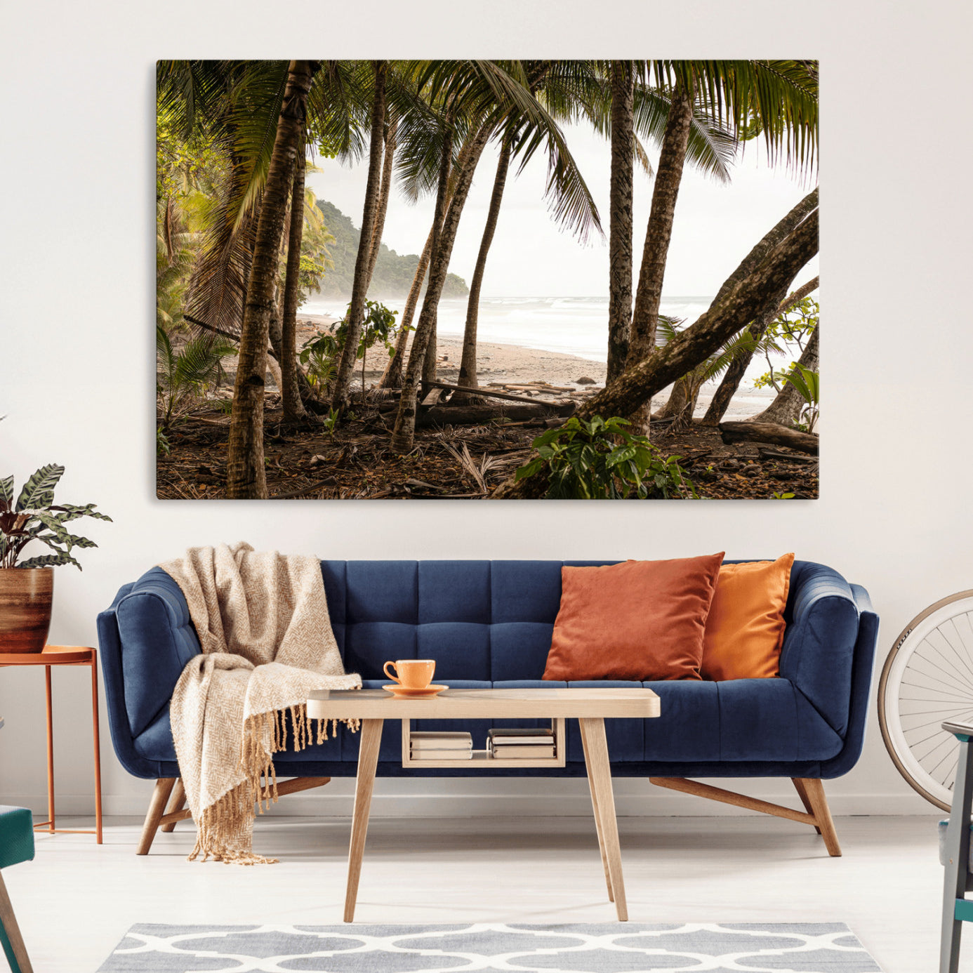 Dense tropical palm trees framing a sandy beach and ocean shore, ideal for jungle or coastal themed interior wall decor.