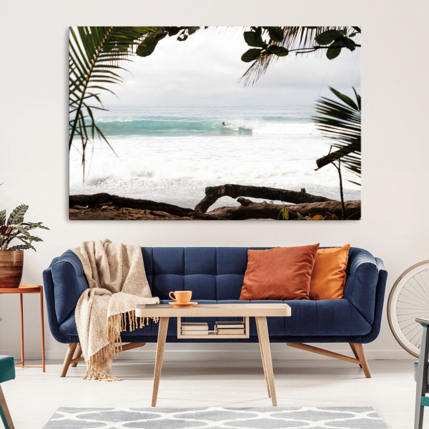 Tropical beach view with palm trees and surfer riding a wave, perfect for boho or coastal-inspired interior wall decor.