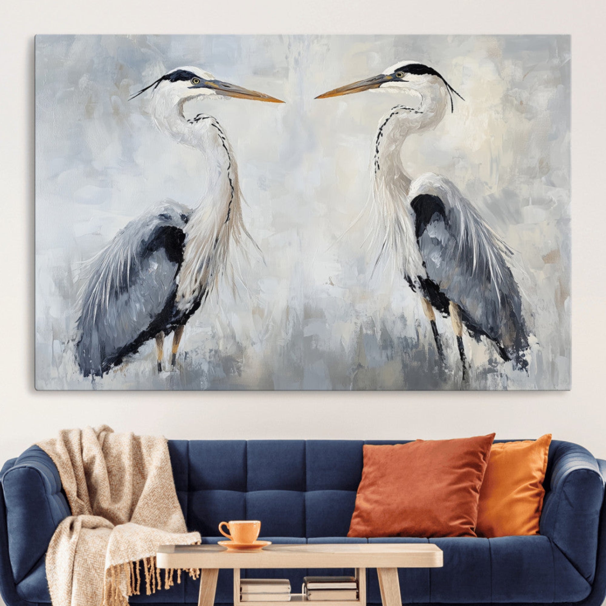 Two herons facing each other on a soft-toned background with blue-grey feathers, perfect for tranquil, coastal or nature-themed interiors.