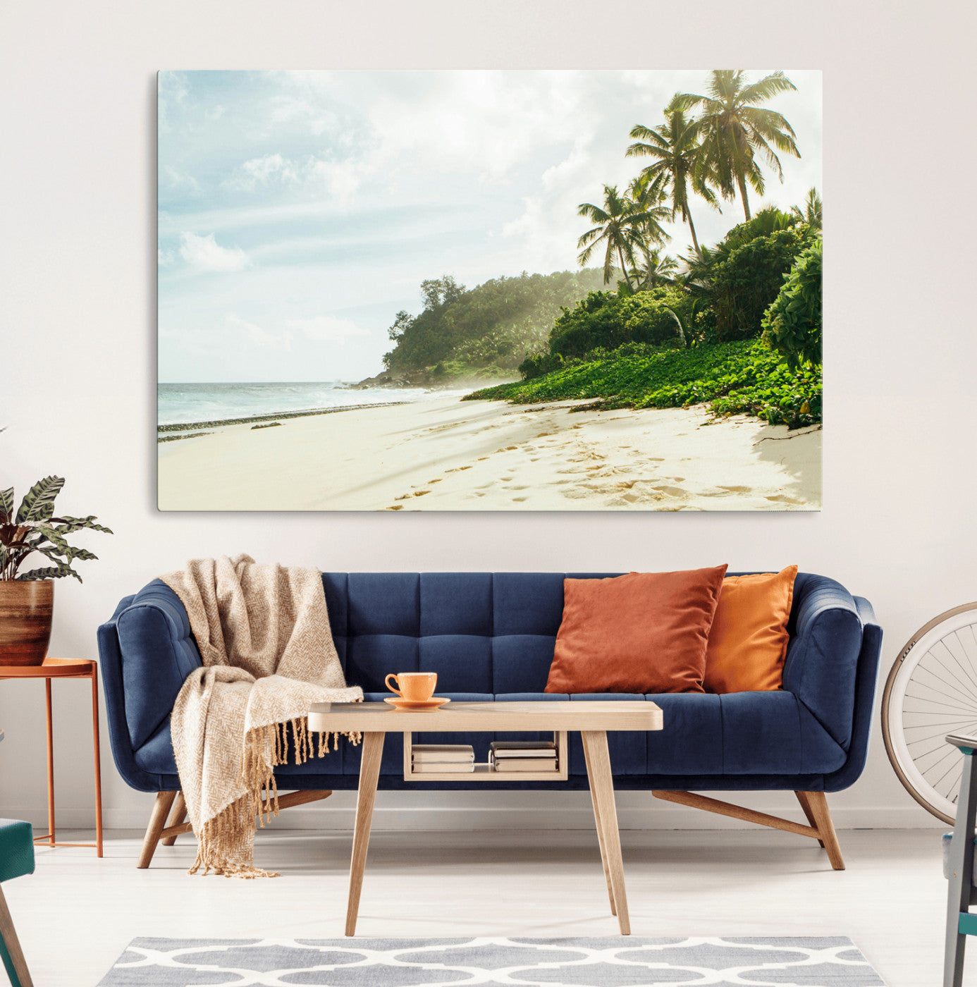 A tropical beach with palm trees, soft sand, and ocean waves under a bright sky, creating a peaceful and relaxing coastal view.