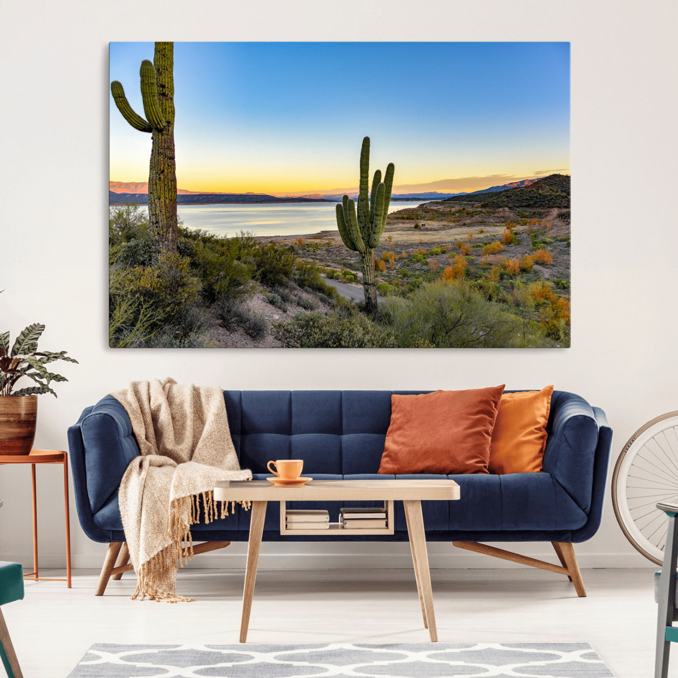 Desert landscape with saguaro cacti and lake at sunset, featuring vibrant sky and hills, ideal for Southwestern or rustic wall decor.