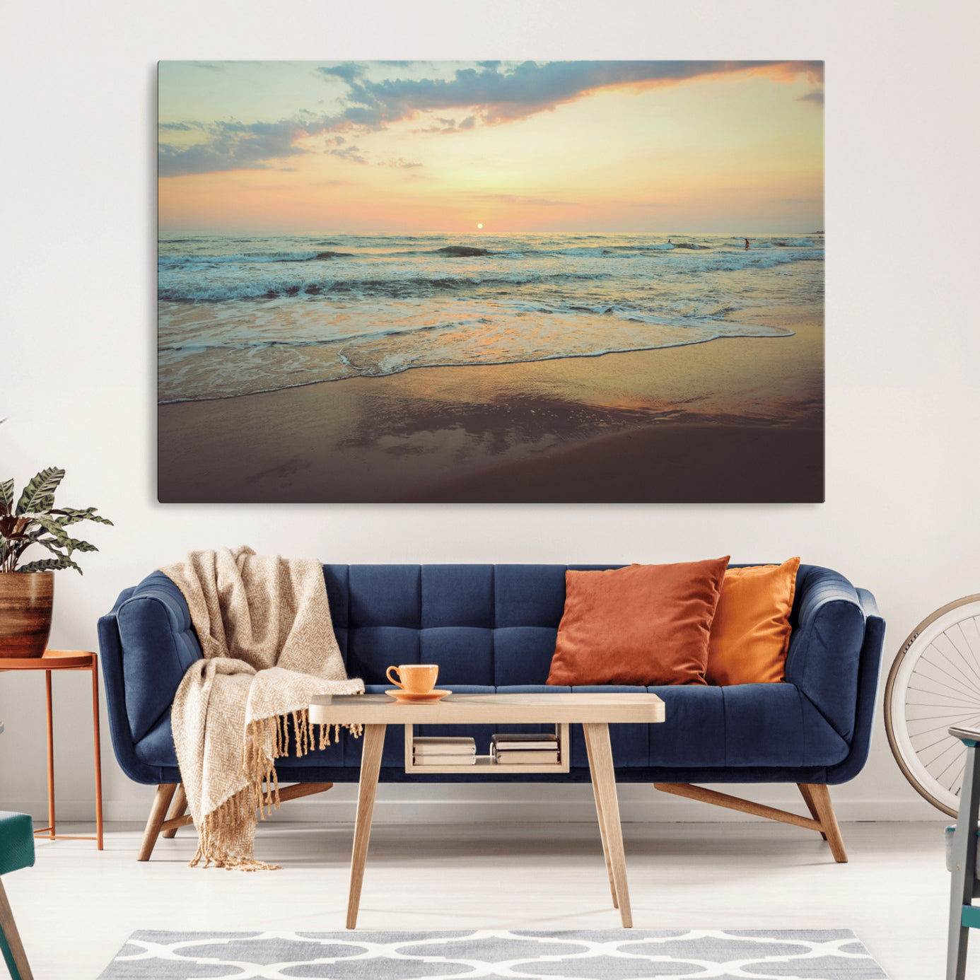 Warm sunset over gentle ocean waves with pastel sky and reflections on wet sand, creating a calm and soothing beach ambiance.
