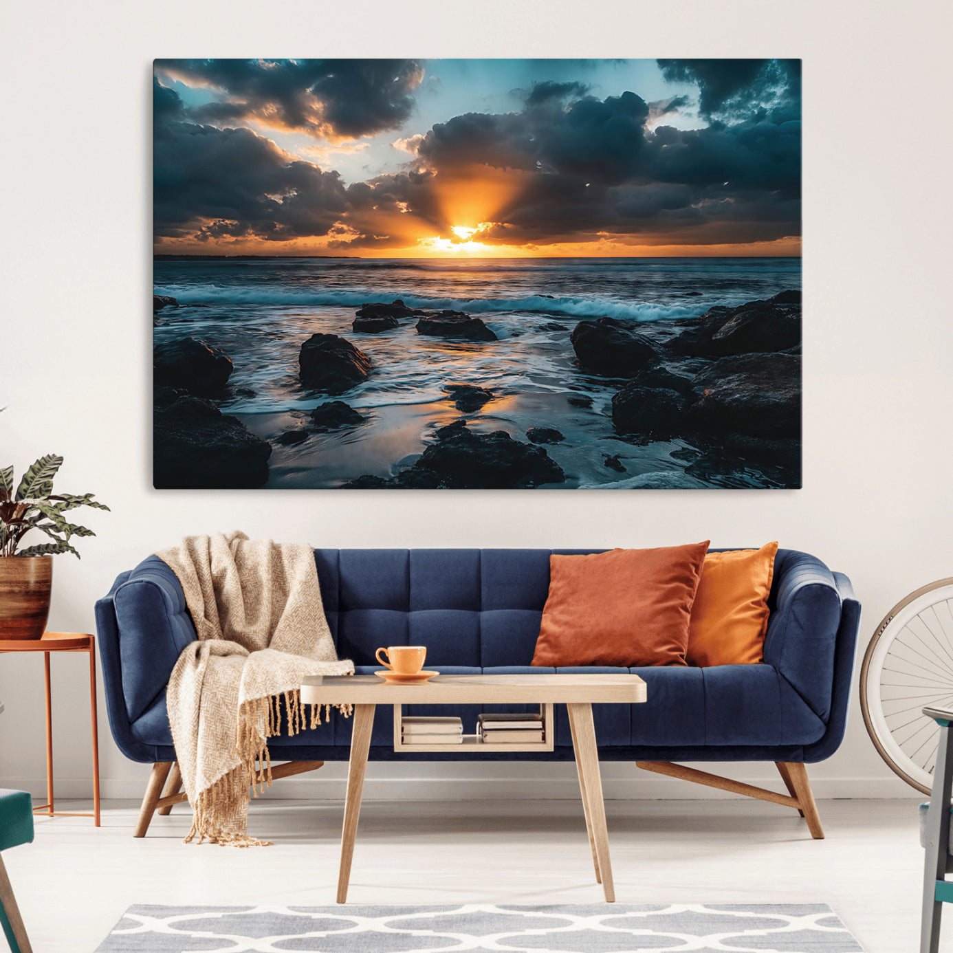An awe-inspiring sunset over the ocean with rays of light piercing through dramatic clouds, creating a beautiful seascape with rocks in the foreground.