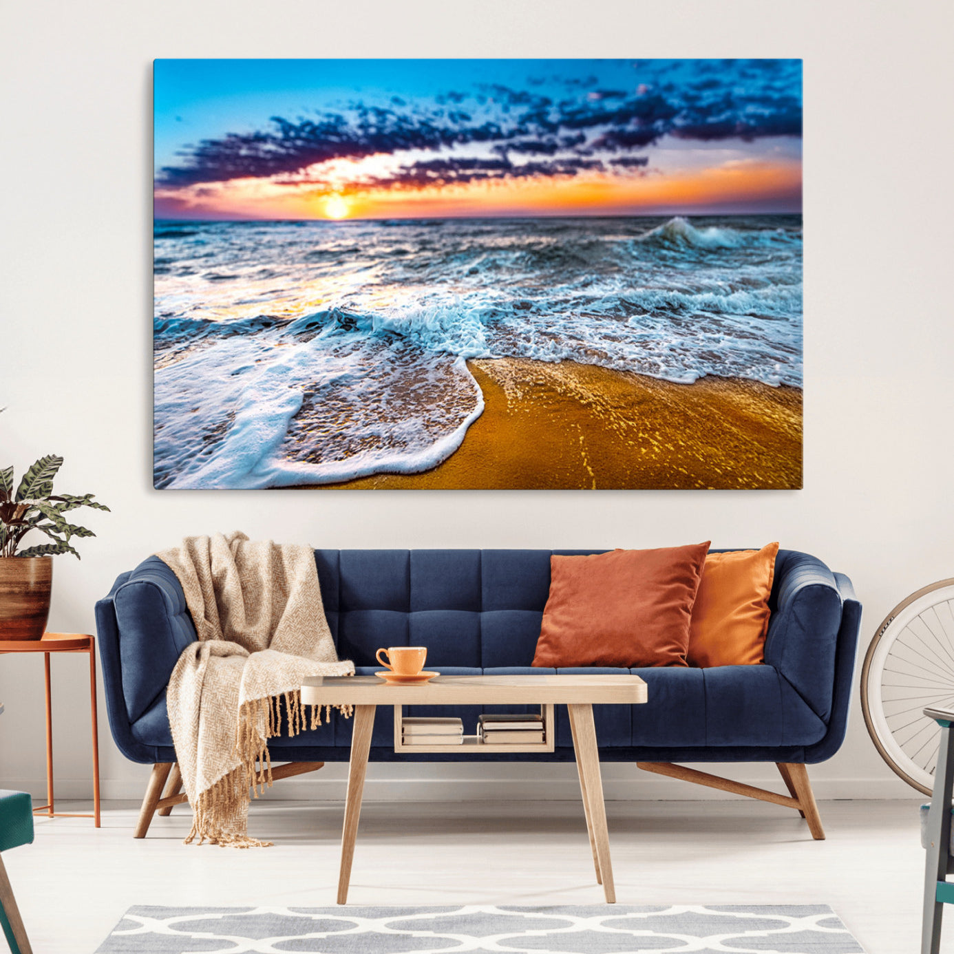 Beautiful ocean shoreline at sunset with foamy waves washing onto golden sand under a colorful sky – Wall Art Canvas Print.