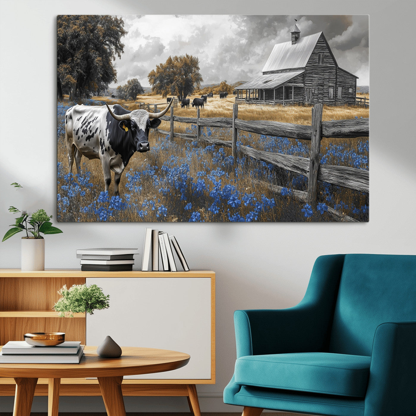 A Texas longhorn stands in front of a rustic barn and wooden fence, with bluebonnets and grazing cattle under dramatic skies.