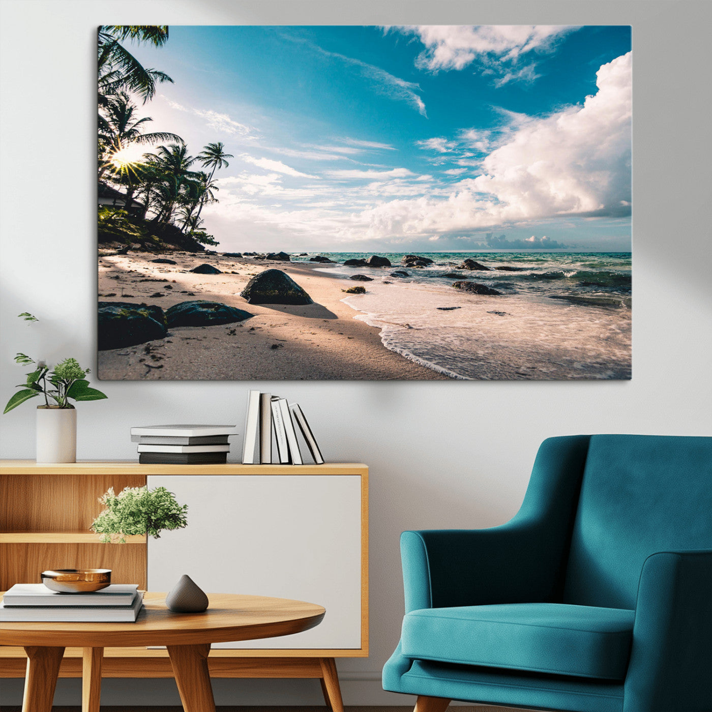 Scenic tropical beach with palm trees, ocean waves, and rocky shoreline under a bright blue sky, creating a serene coastal vibe.