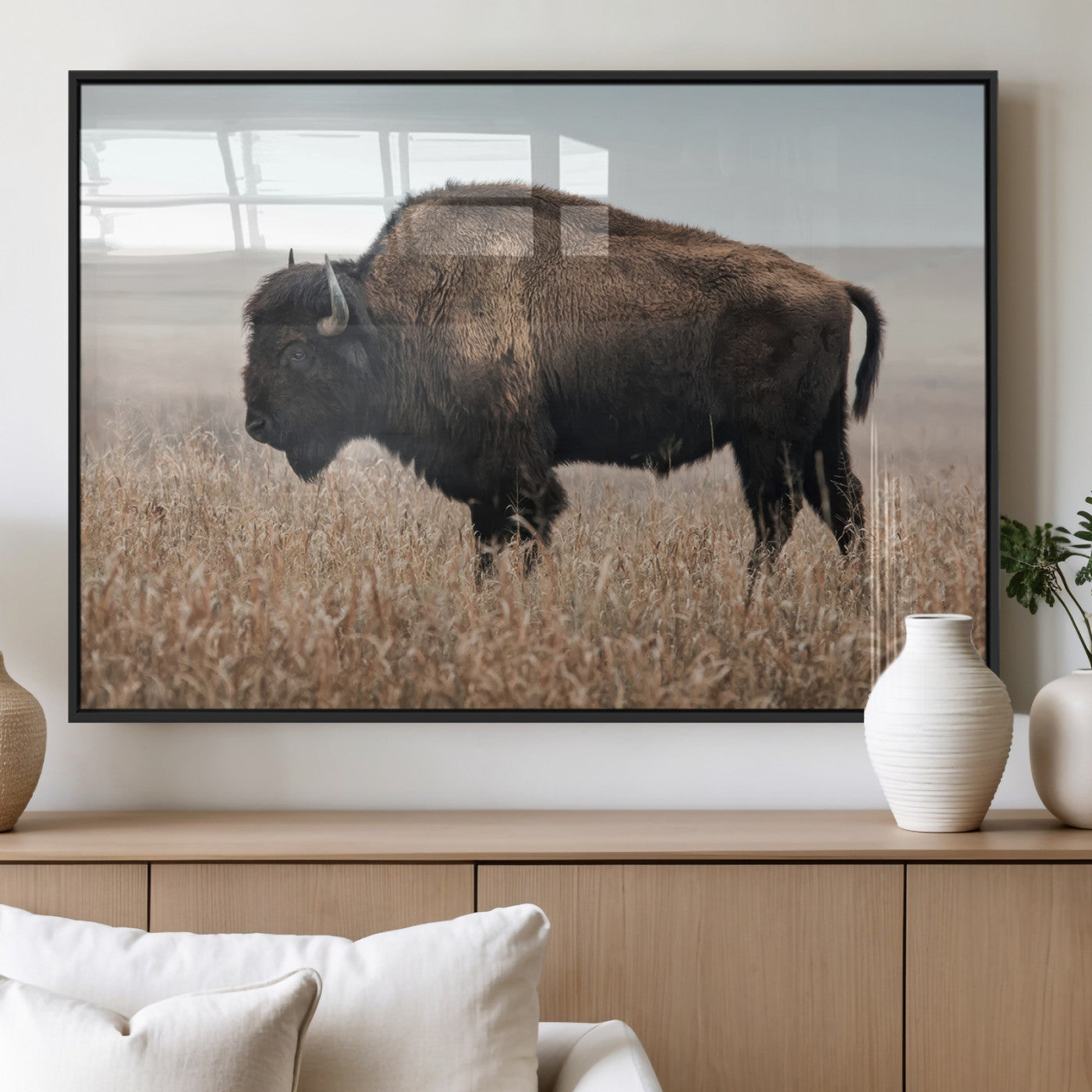 A lone bison stands in a vast prairie under a soft sky, evoking freedom and rustic charm for western or farmhouse inspired interiors.