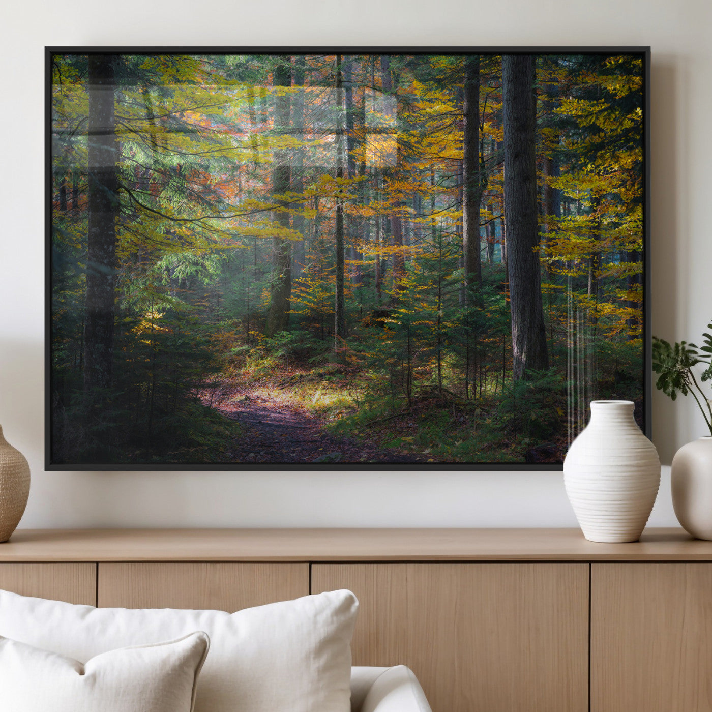 A serene autumn forest with golden and green leaves, a misty atmosphere, and a sunlit pathway, creating a tranquil nature-inspired wall art piece.