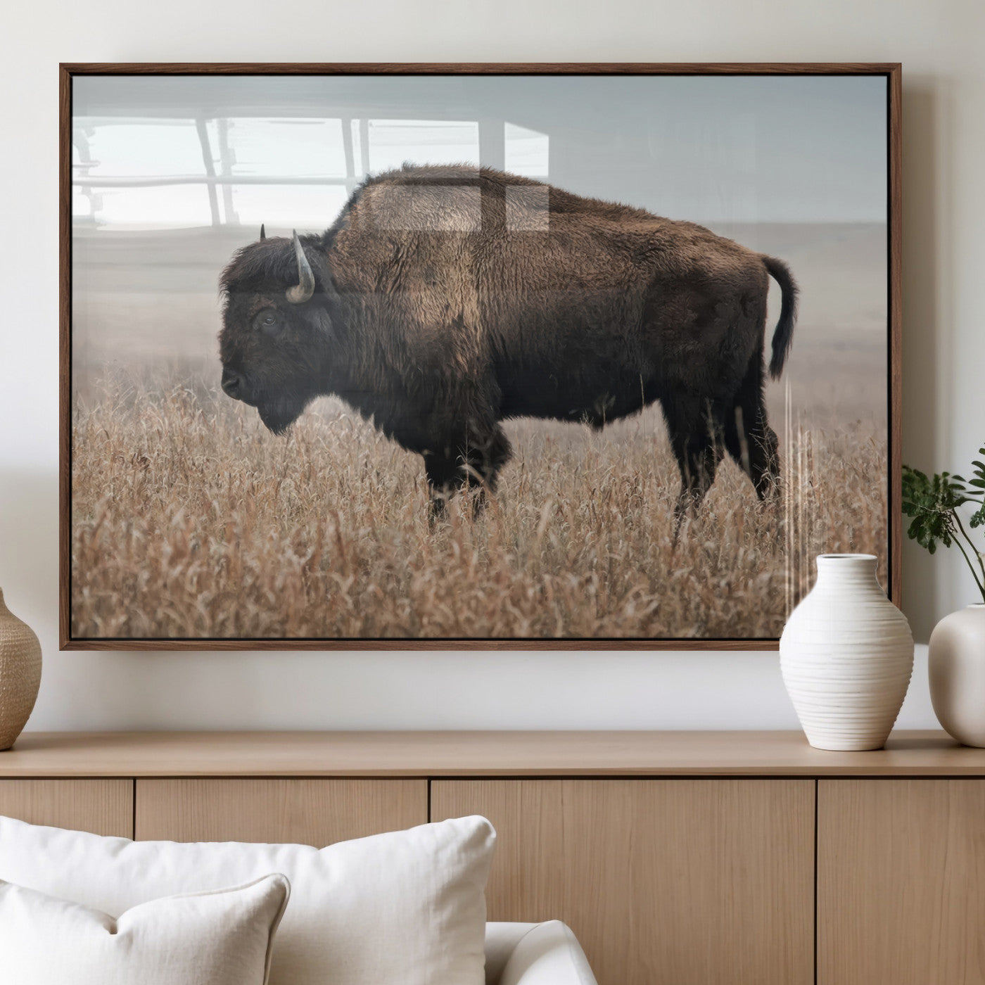 A lone bison stands in a vast prairie under a soft sky, evoking freedom and rustic charm for western or farmhouse inspired interiors.