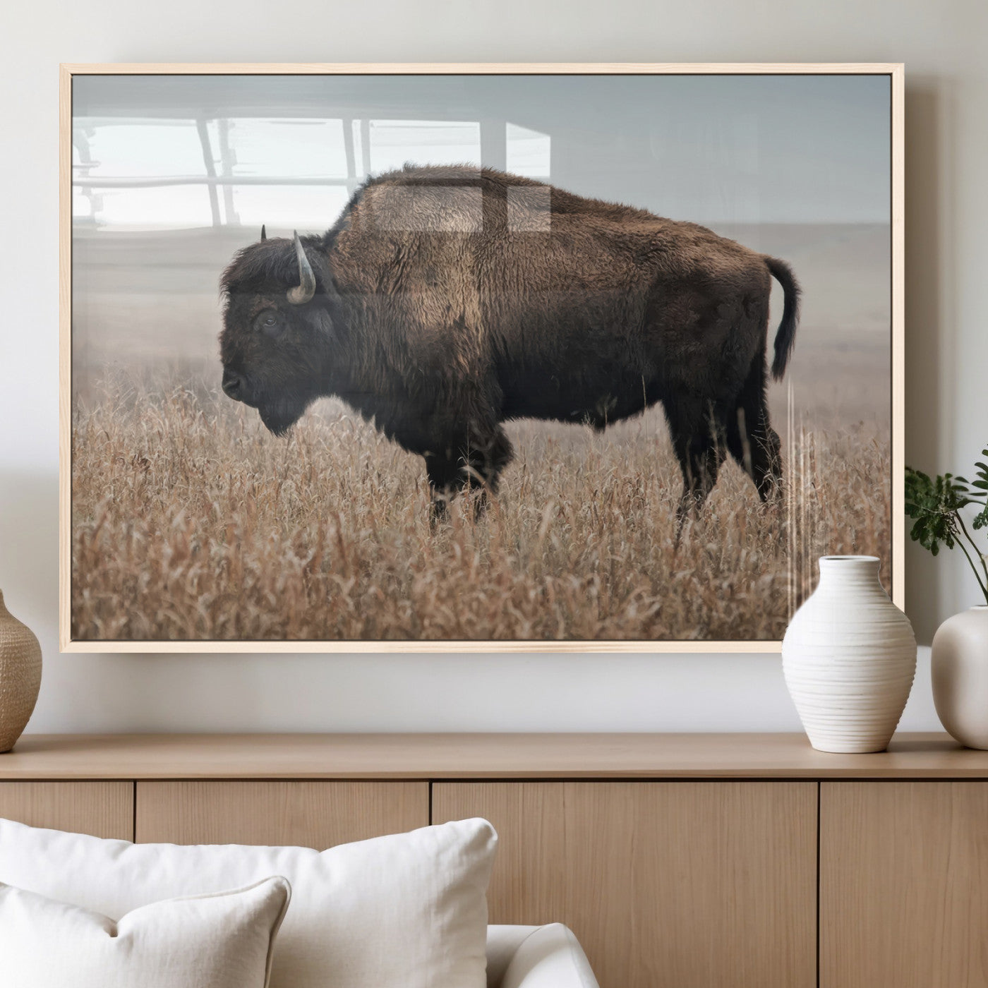 A lone bison stands in a vast prairie under a soft sky, evoking freedom and rustic charm for western or farmhouse inspired interiors.