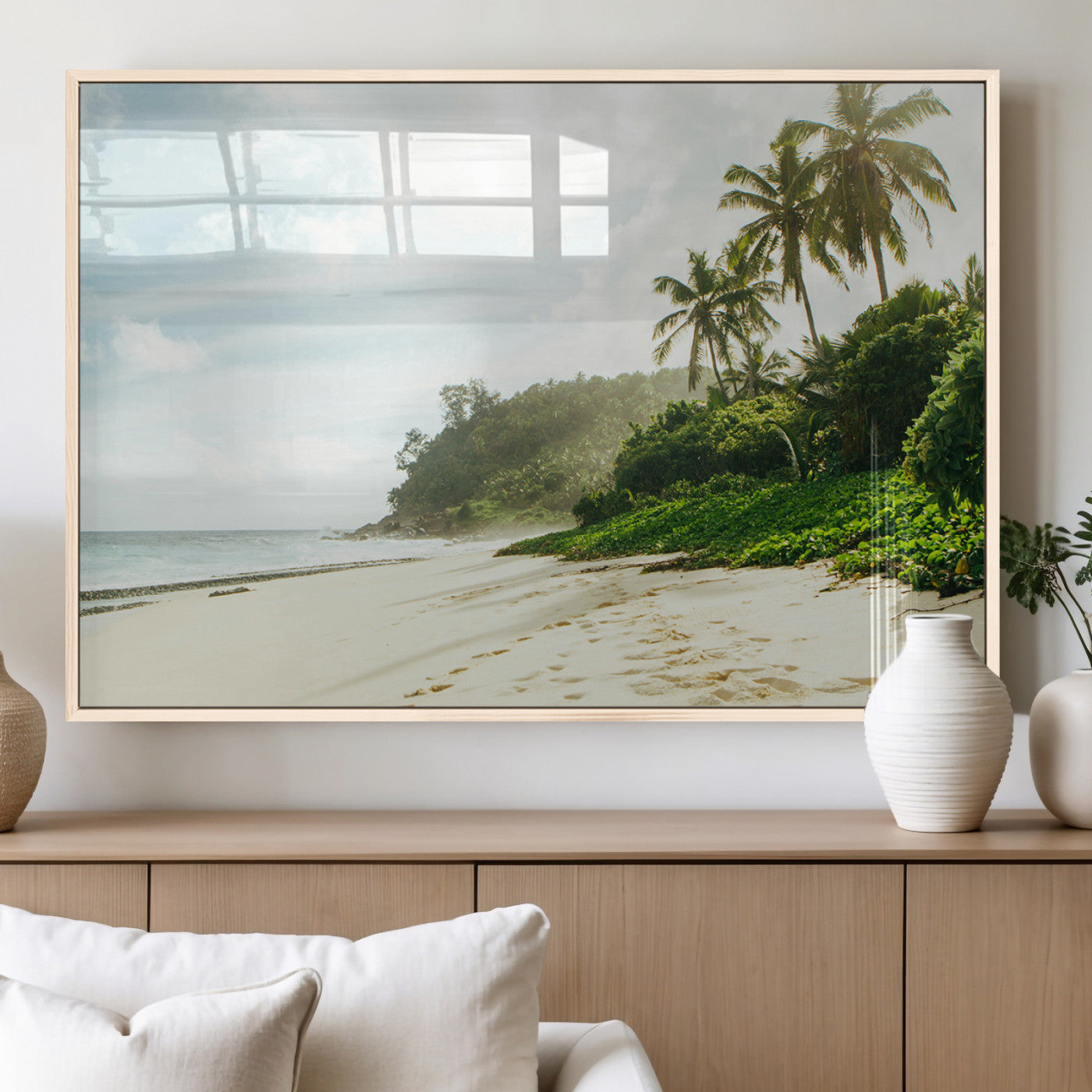 A tropical beach with palm trees, soft sand, and ocean waves under a bright sky, creating a peaceful and relaxing coastal view.