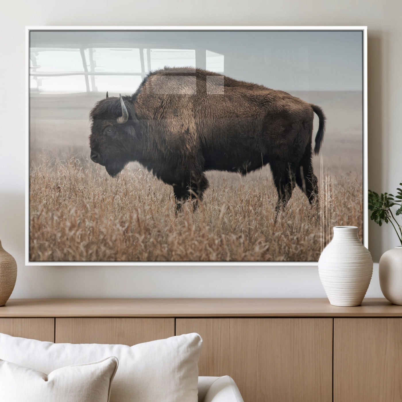 A lone bison stands in a vast prairie under a soft sky, evoking freedom and rustic charm for western or farmhouse inspired interiors.