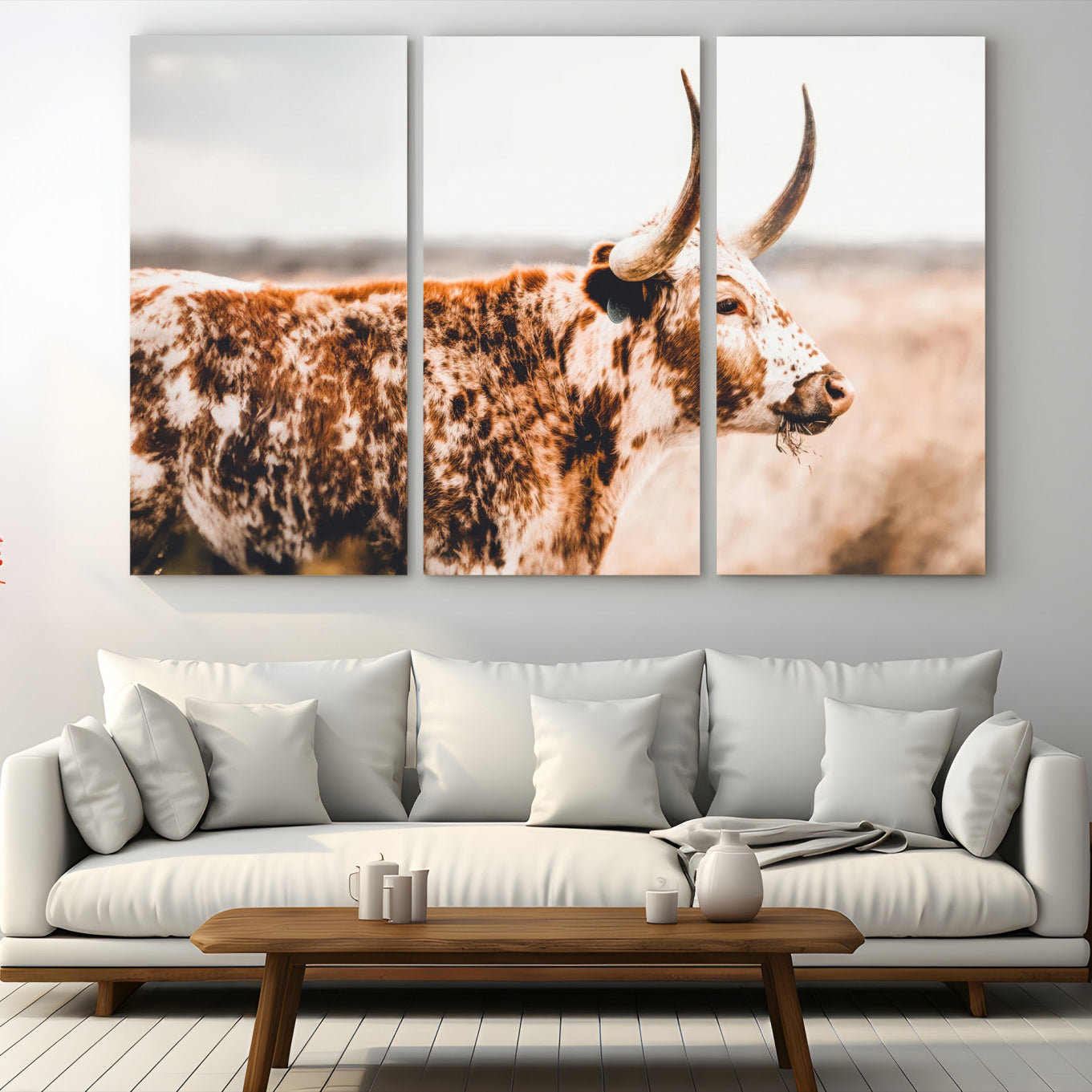 Speckled Texas longhorn with curved horns standing in a warm-toned prairie, perfect for rustic or country-style home decor.