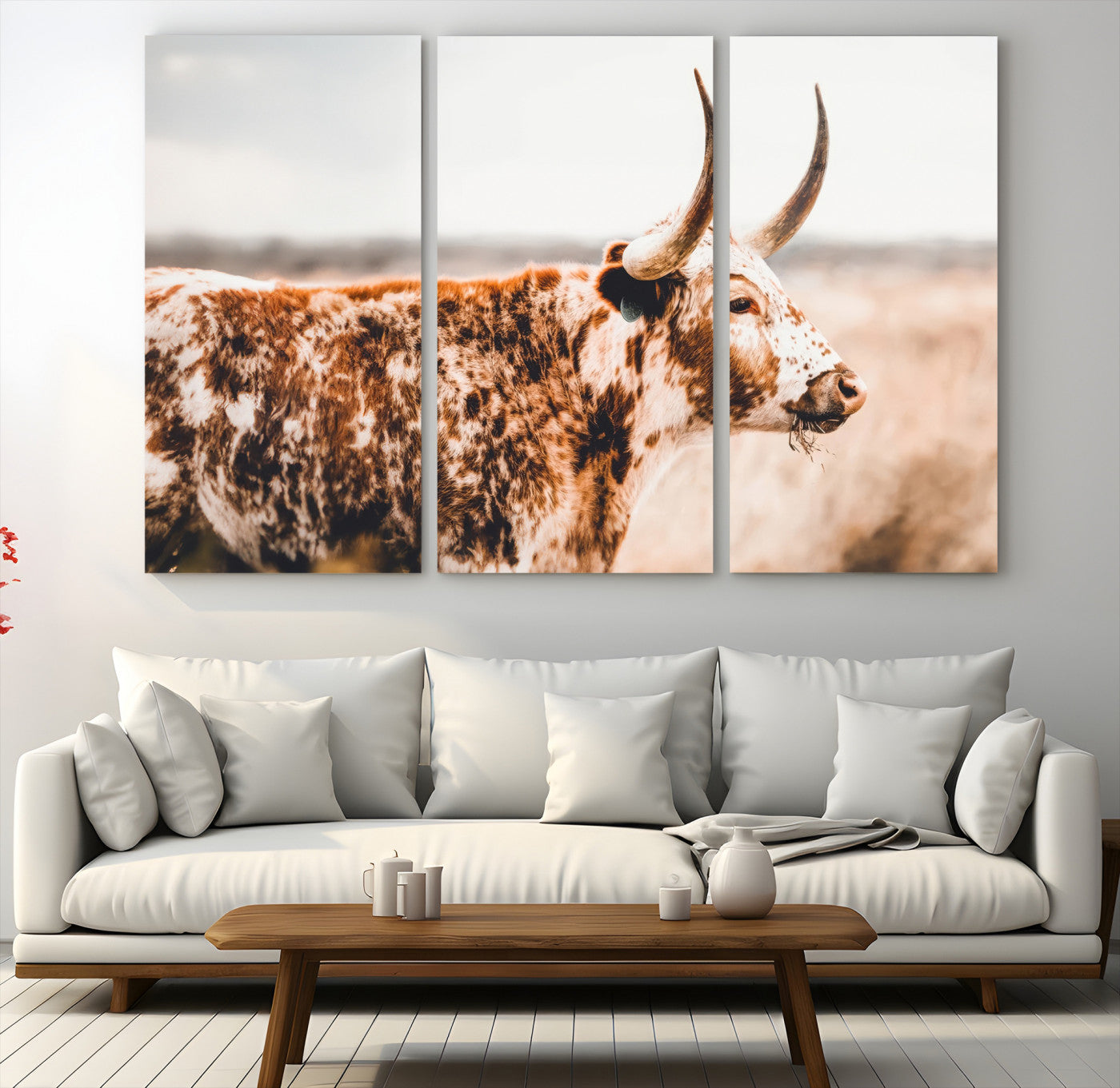 Speckled Texas longhorn with curved horns standing in a warm-toned prairie, perfect for rustic or country-style home decor.