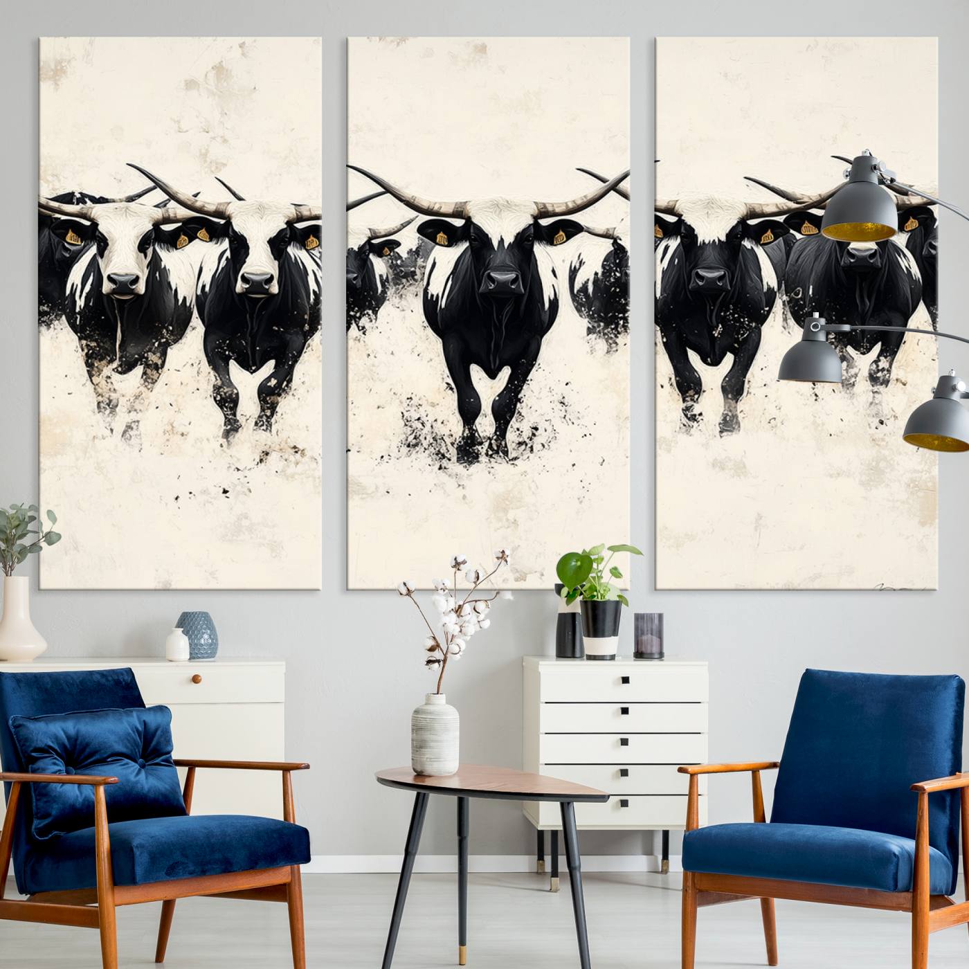 Canvas artwork of black and white Texas longhorns in a bold stampede over a minimalist background, ideal for rustic modern or Western-themed decor.