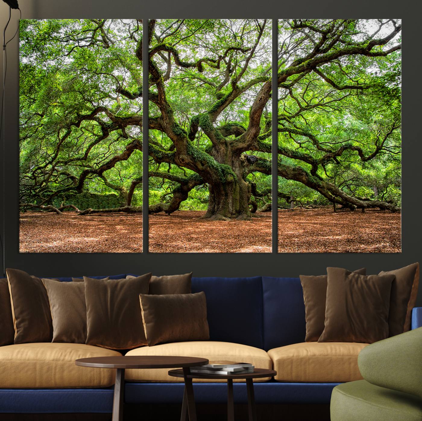 A majestic, ancient tree with expansive, twisting branches spreading wide under a dense, vibrant green canopy in a serene forest clearing.
