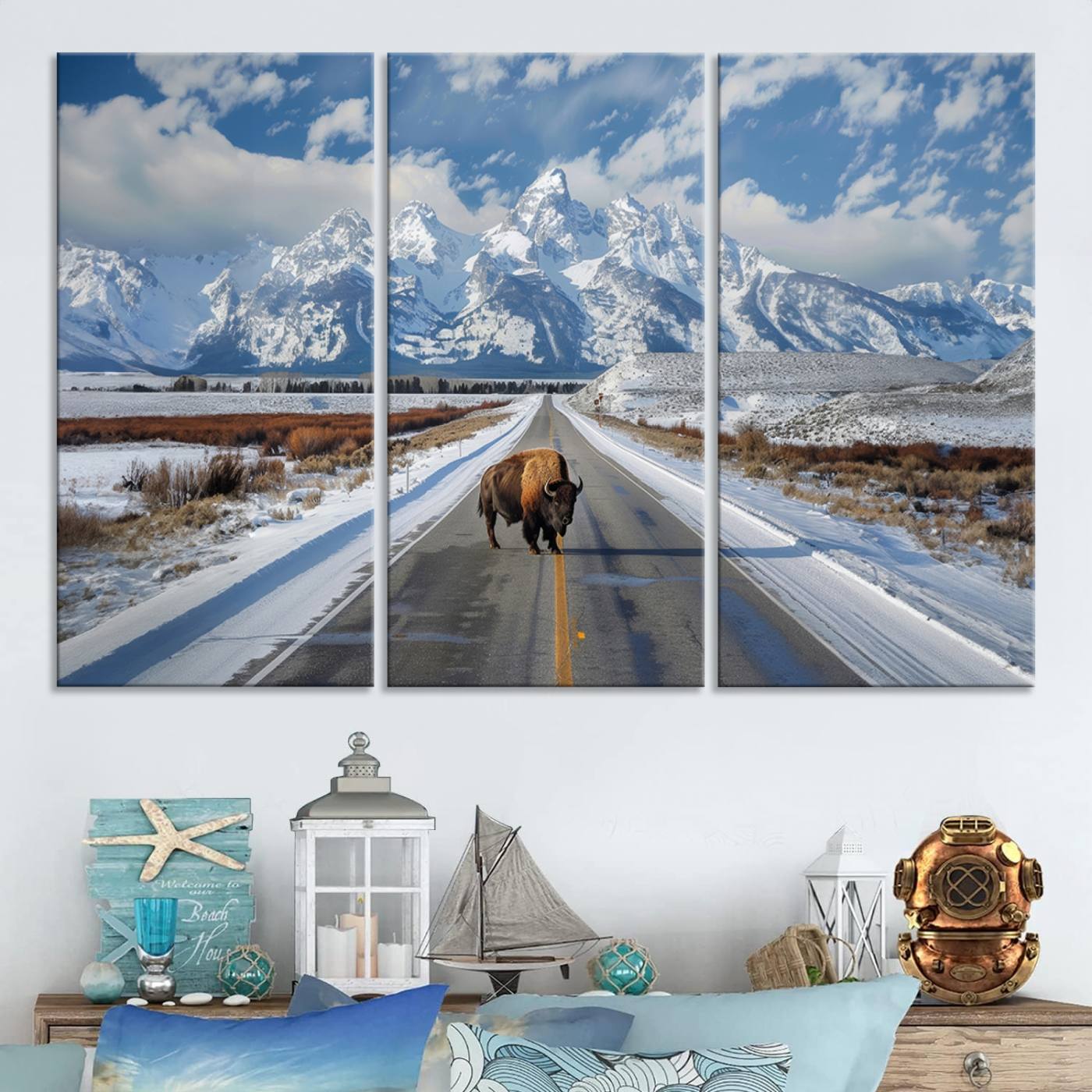 A powerful bison stands on a snow-dusted road beneath the towering peaks of the Grand Tetons, capturing the untamed beauty of America's winter wilderness.