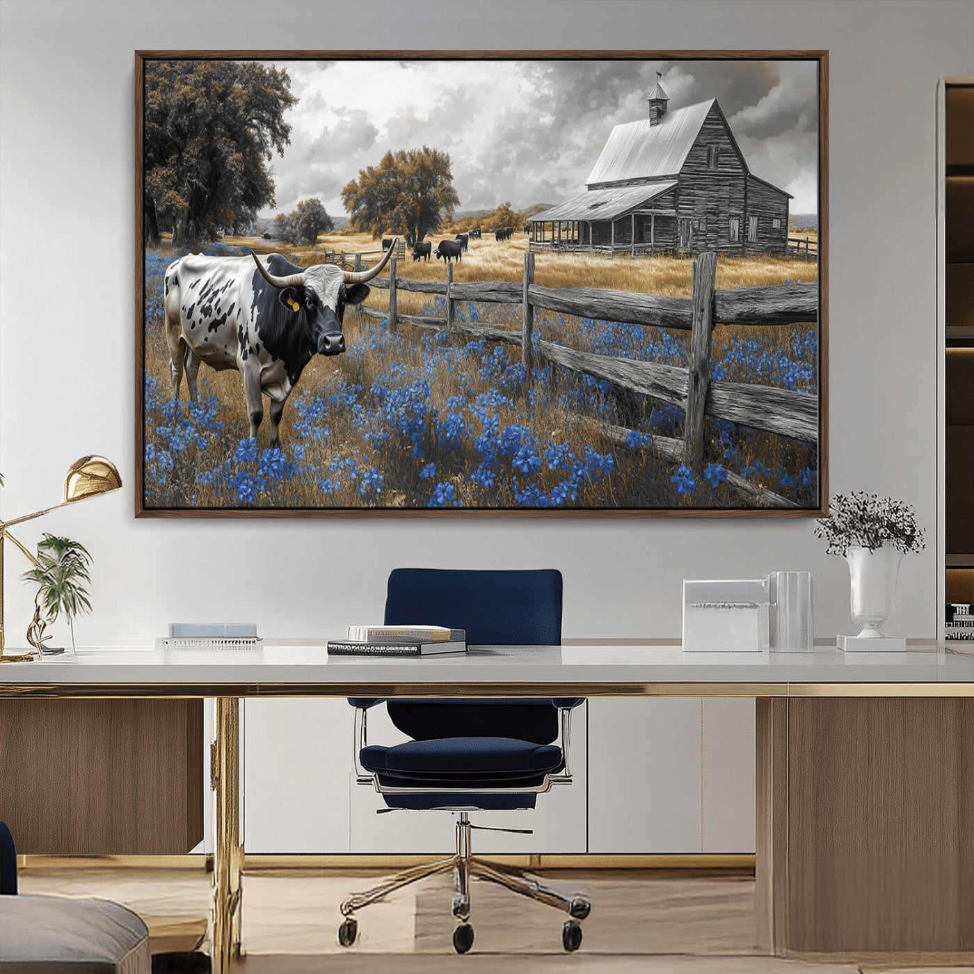 A Texas longhorn stands in front of a rustic barn and wooden fence, with bluebonnets and grazing cattle under dramatic skies.