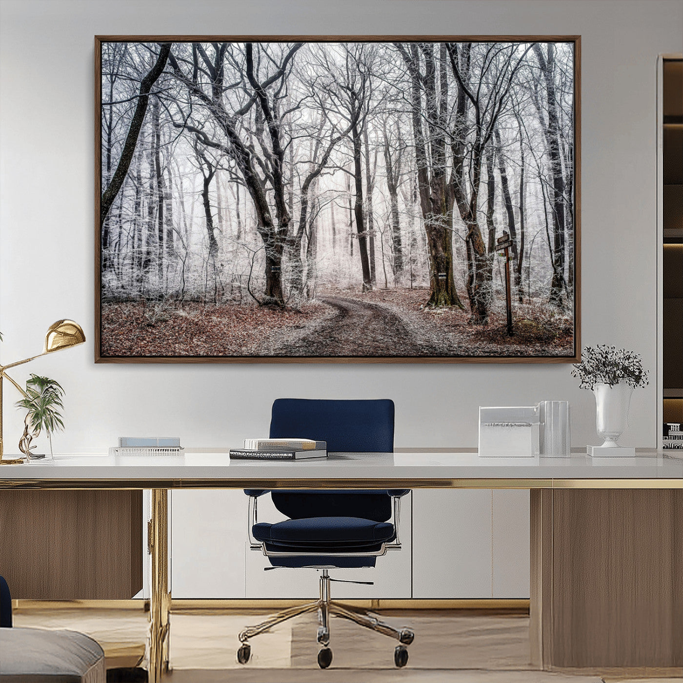 Snow-covered trees in a misty winter forest with a winding path, creating a serene and mysterious atmosphere, perfect for nature-inspired wall art.