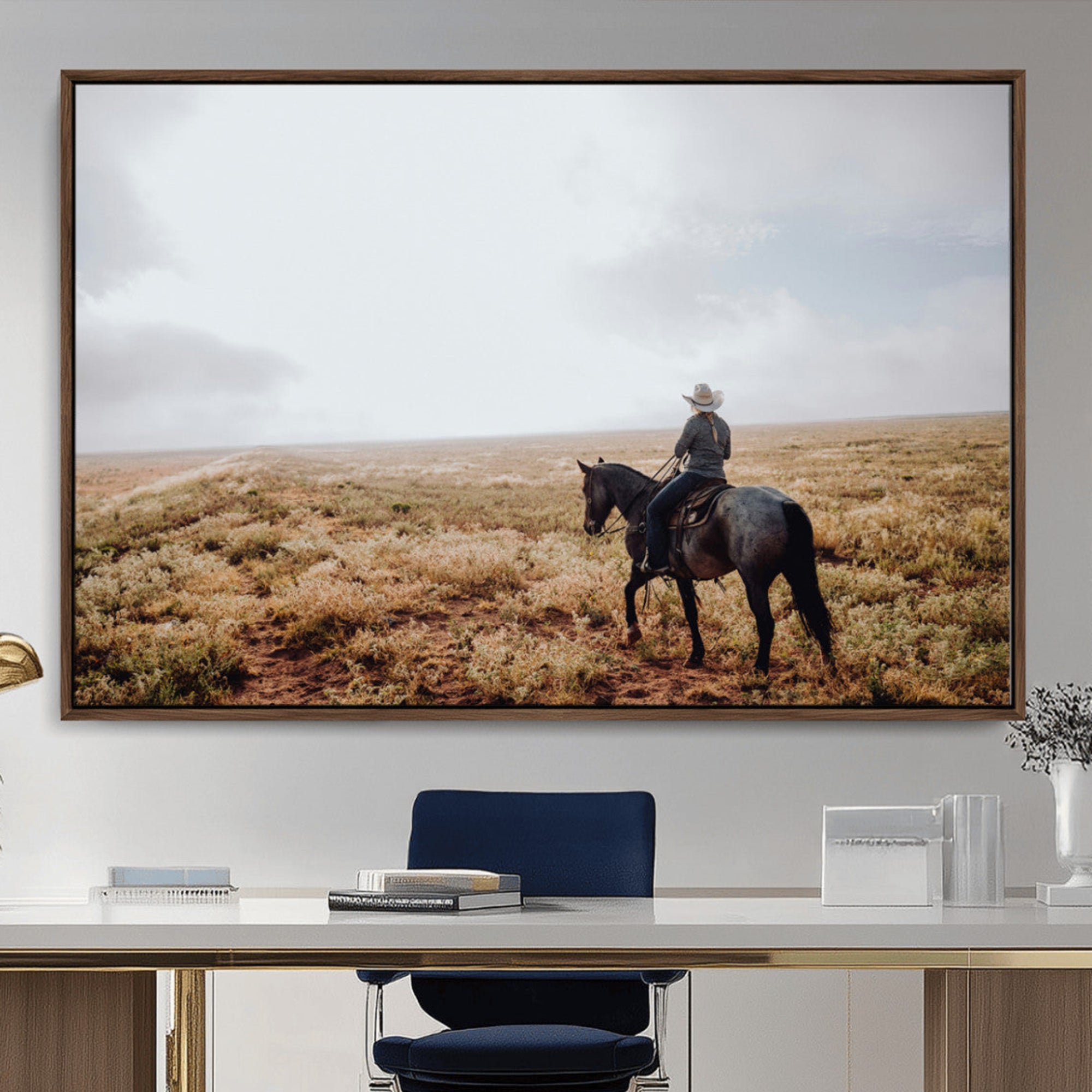 A lone cowboy riding horseback across an open prairie under a vast sky, capturing the rugged and timeless spirit of the Western frontier.