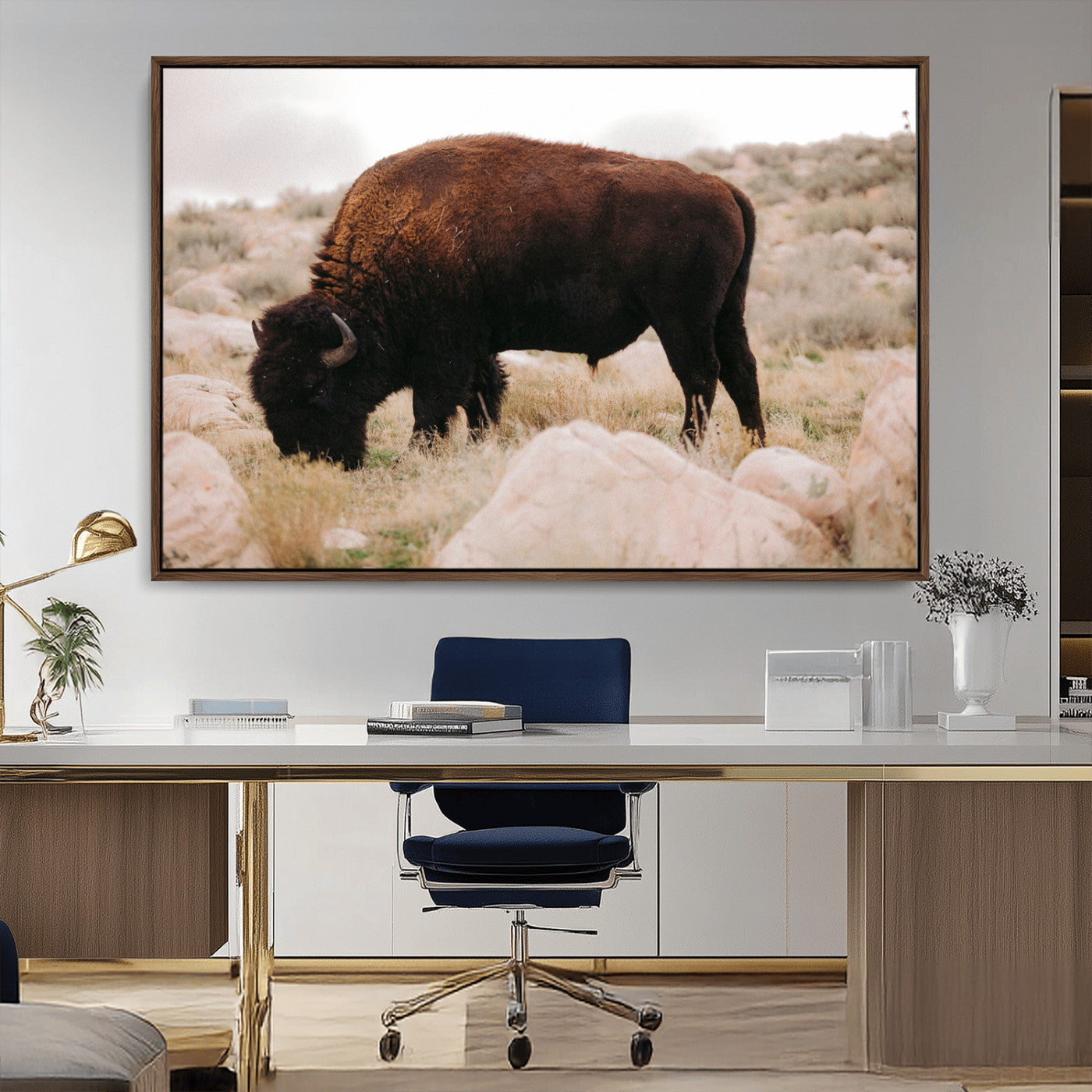 A solitary bison grazing in a rugged prairie with earthy tones and scattered rocks, capturing the essence of the American West for rustic decor.