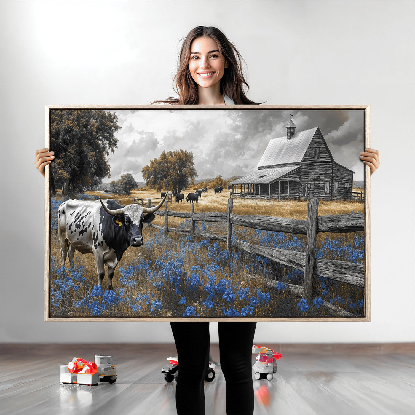 A Texas longhorn stands in front of a rustic barn and wooden fence, with bluebonnets and grazing cattle under dramatic skies.