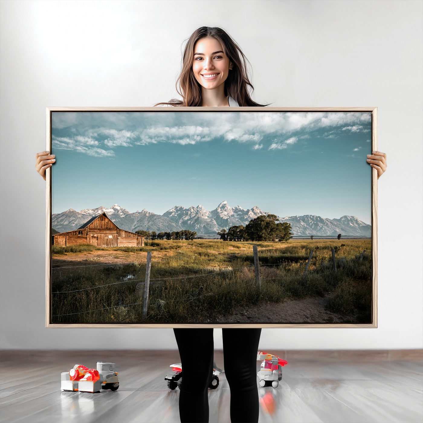 A rustic farmhouse with a wooden barn set against majestic mountain peaks under a soft blue sky, evoking peaceful countryside charm.