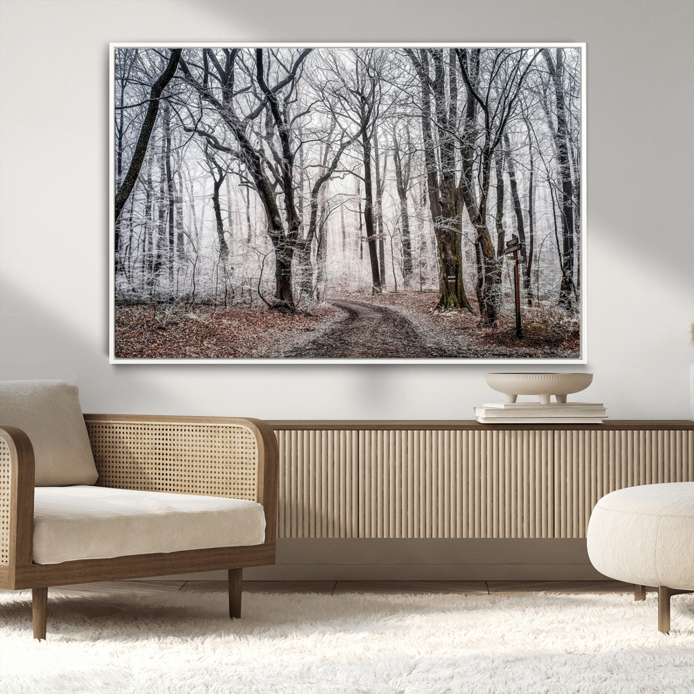 Snow-covered trees in a misty winter forest with a winding path, creating a serene and mysterious atmosphere, perfect for nature-inspired wall art.