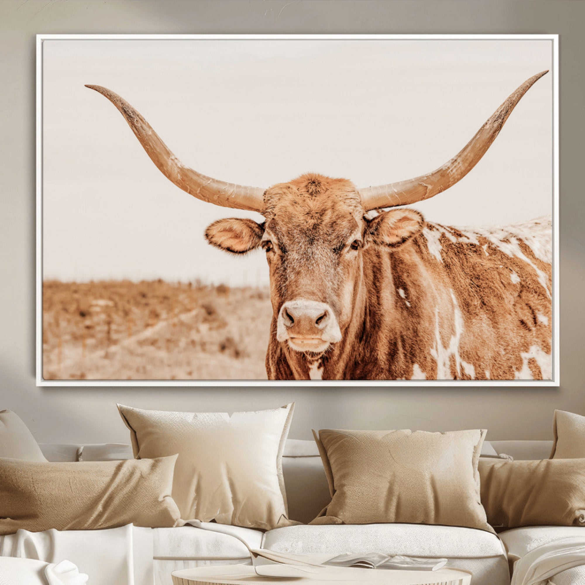 Sepia-toned Texas Longhorn facing forward in a dry field, perfect for rustic farmhouse or western-themed neutral home decor.