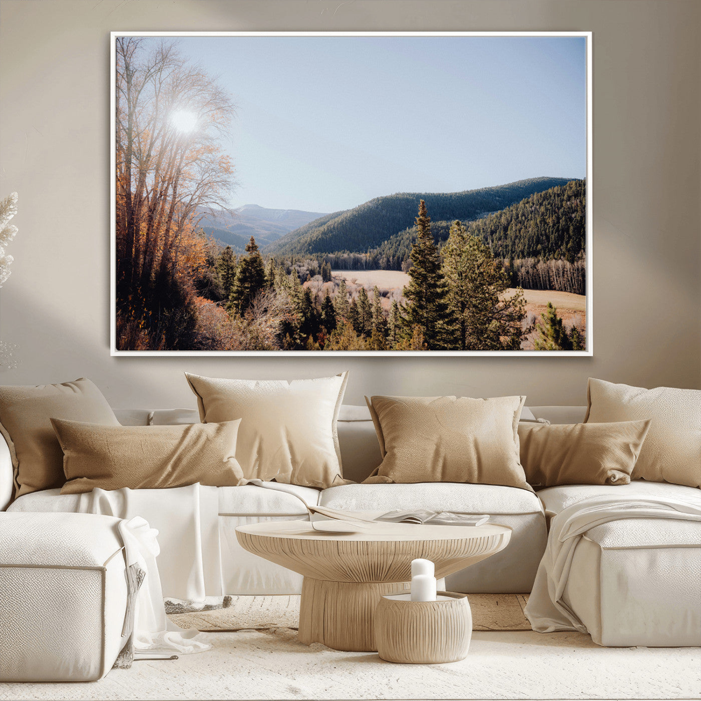 A scenic mountain valley with pine trees and autumn foliage under a clear sky, bathed in golden sunlight, creating a peaceful and rustic landscape.