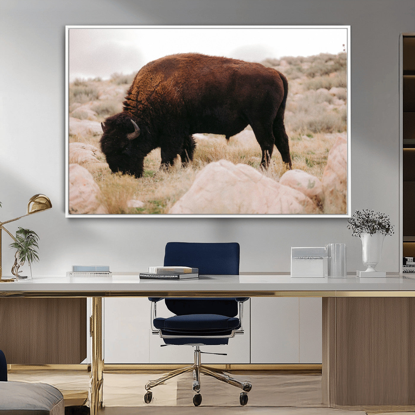 A solitary bison grazing in a rugged prairie with earthy tones and scattered rocks, capturing the essence of the American West for rustic decor.