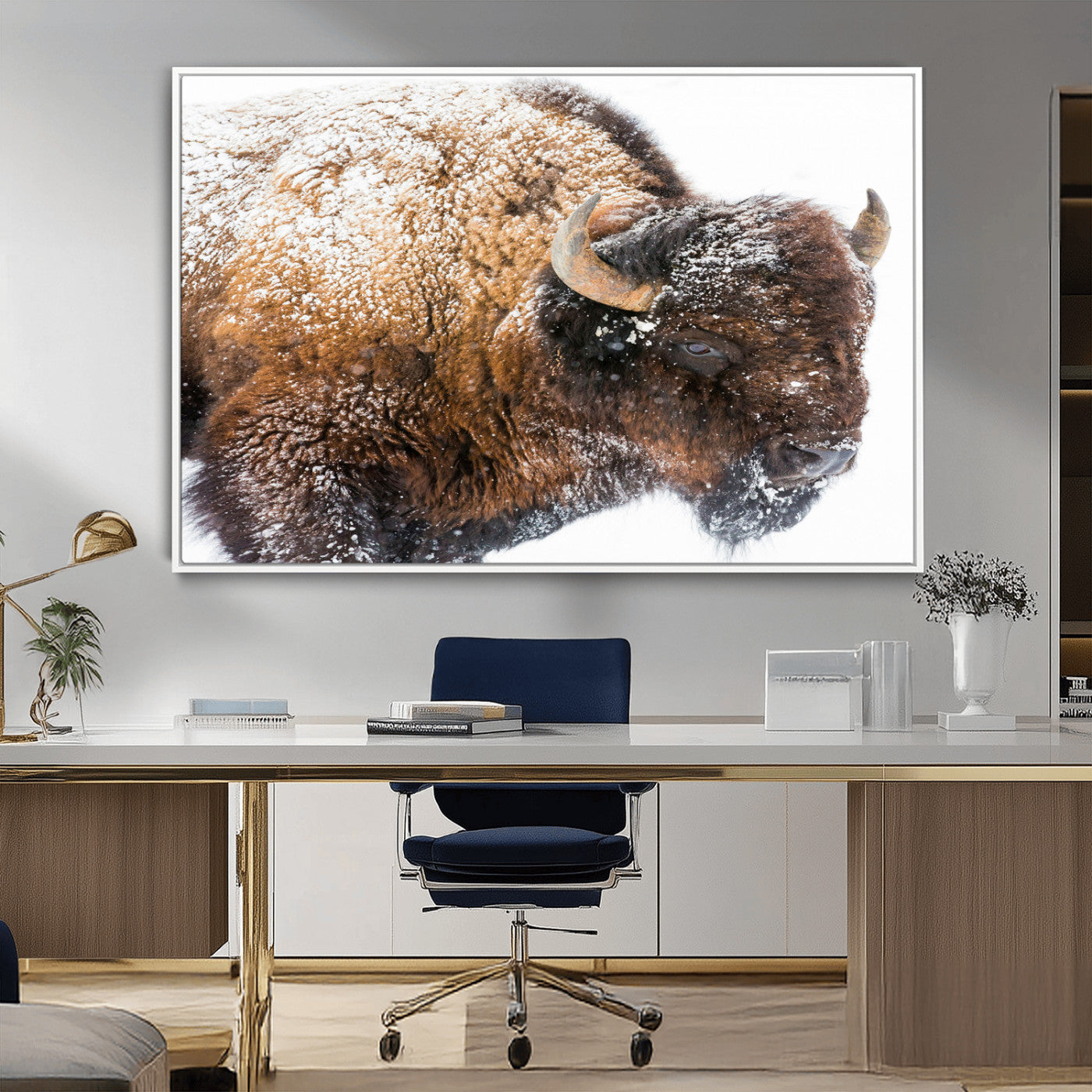 Close-up photograph of a bison covered in snow, highlighting its thick fur and powerful presence, set against a white winter backdrop, ideal for rustic decor.