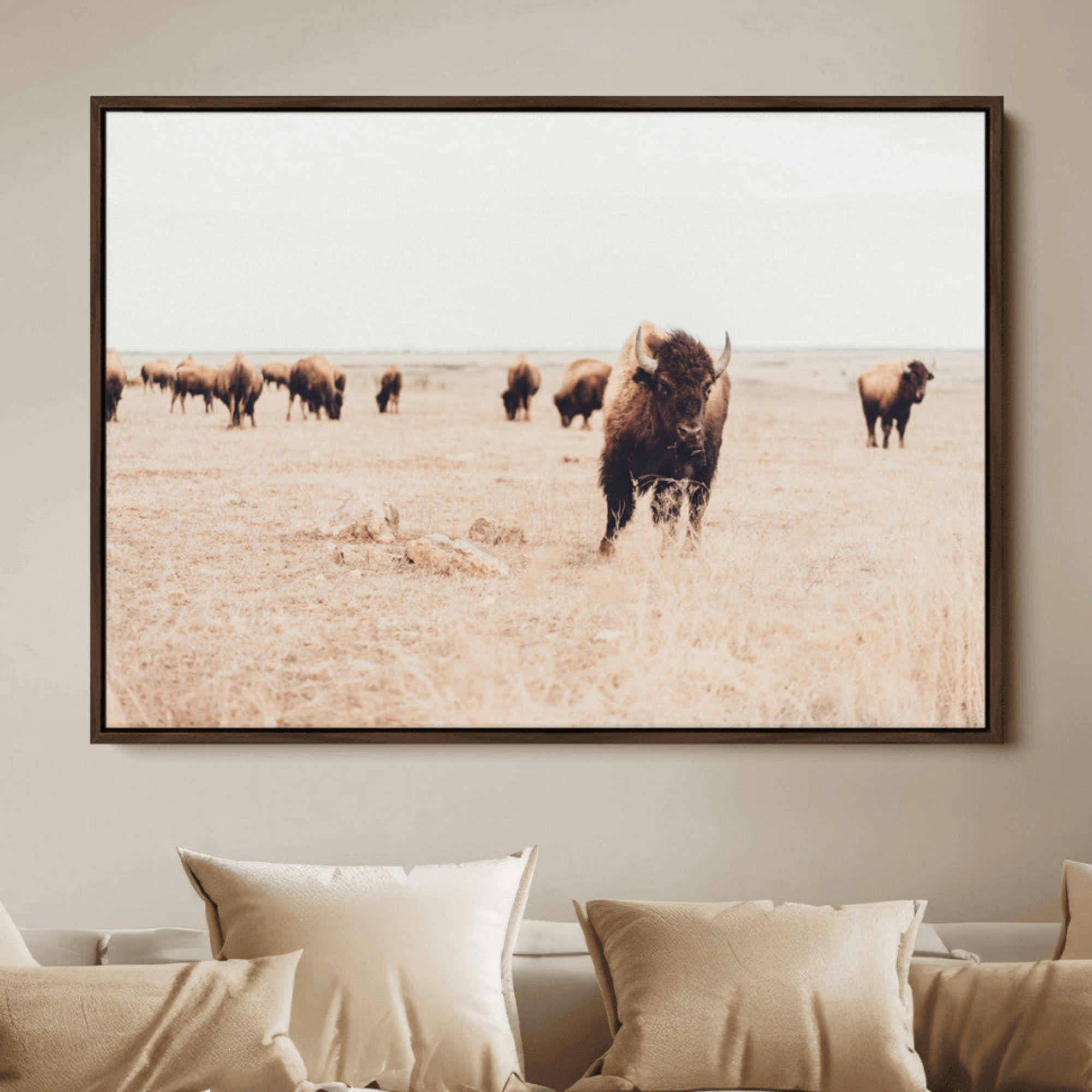 Herd of bison roaming a vast prairie with golden grass under a soft sky, creating a rustic and Western landscape, ideal for wall art.