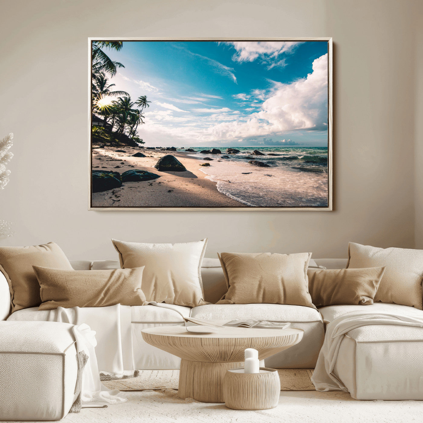 Scenic tropical beach with palm trees, ocean waves, and rocky shoreline under a bright blue sky, creating a serene coastal vibe.