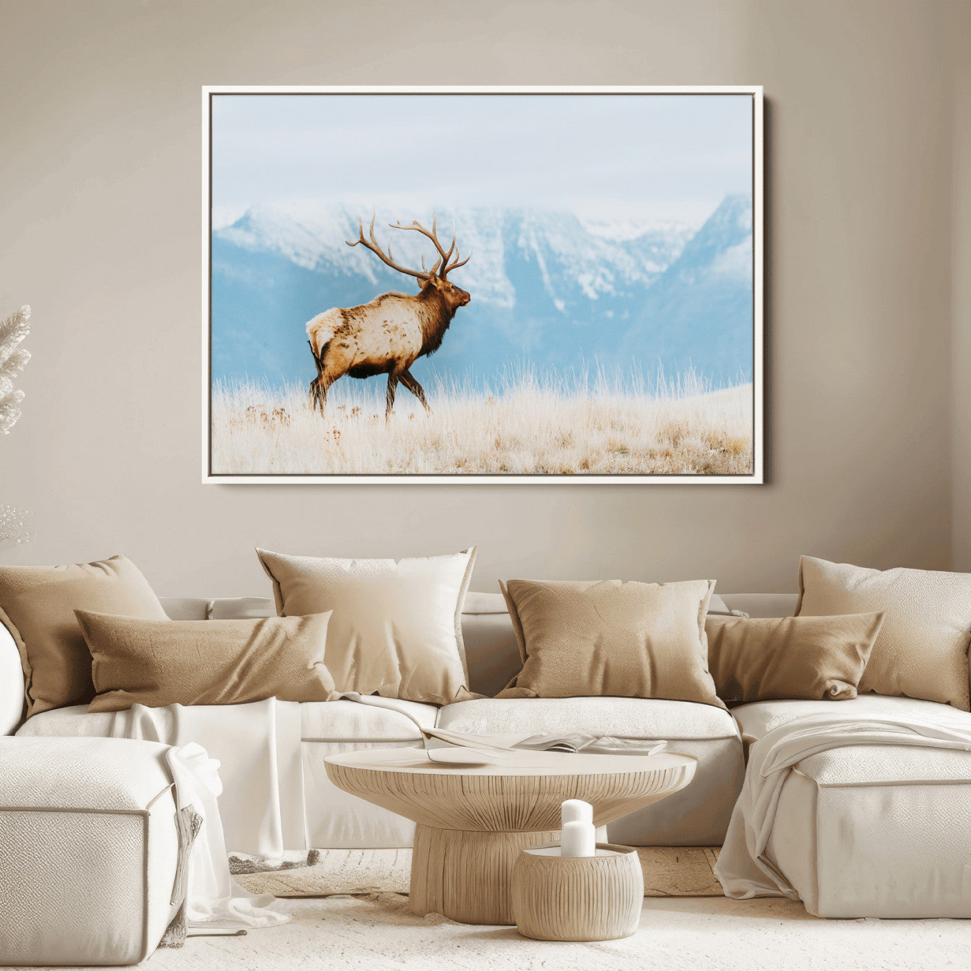 Majestic elk with antlers walking on golden grass, snowy mountains behind, perfect for rustic lodge or Scandinavian decor.