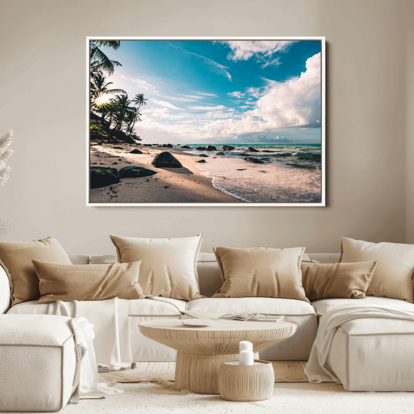 Scenic tropical beach with palm trees, ocean waves, and rocky shoreline under a bright blue sky, creating a serene coastal vibe.