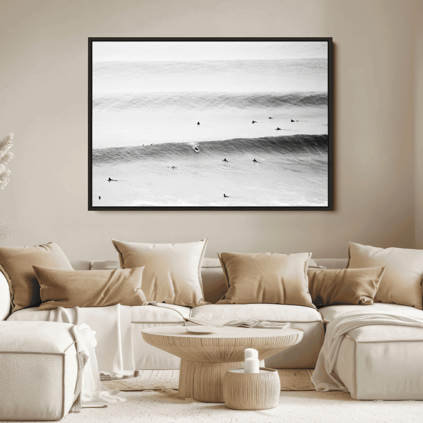 A monochrome photograph of swimmers gliding through gentle ocean waves, evoking a sense of calm and movement.