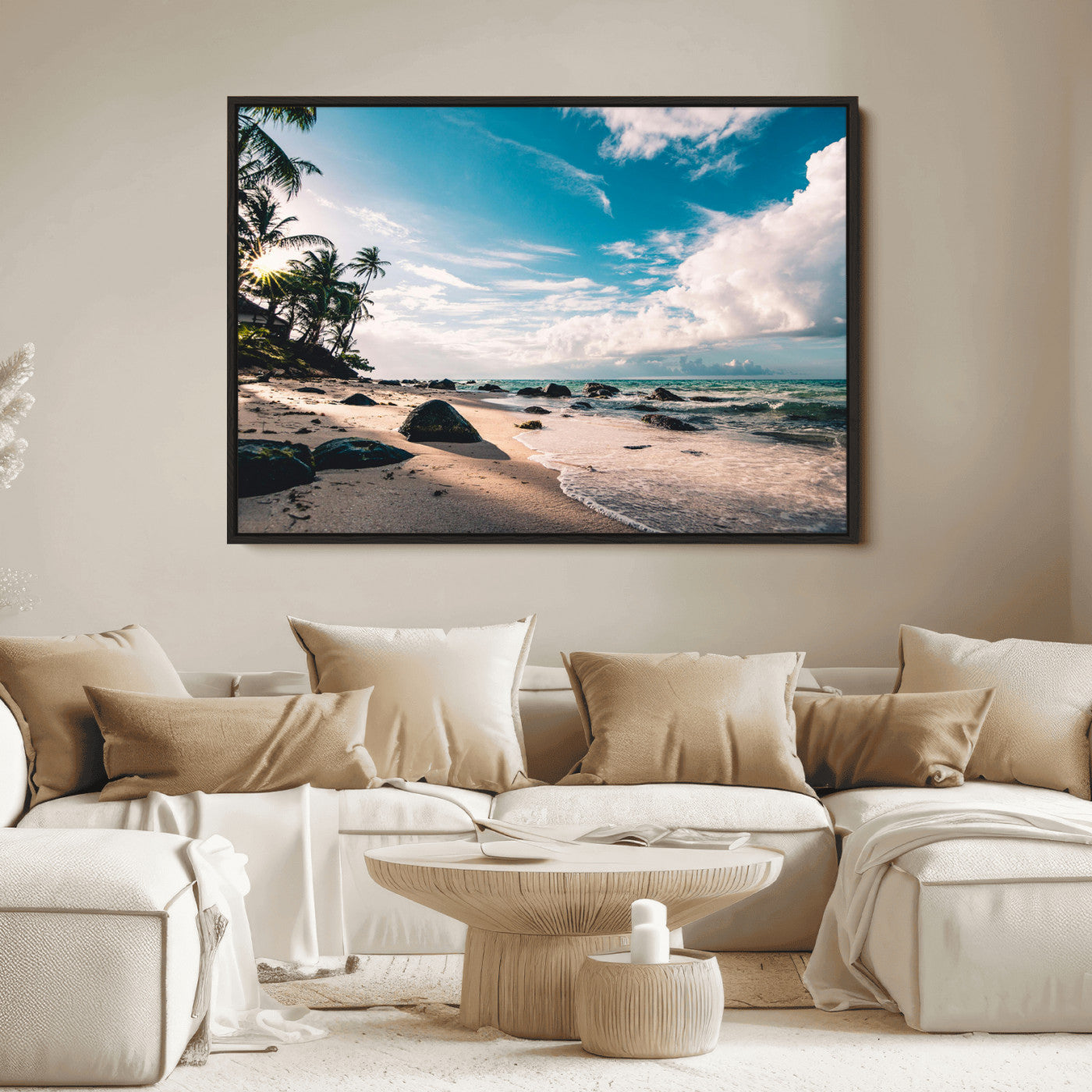 Scenic tropical beach with palm trees, ocean waves, and rocky shoreline under a bright blue sky, creating a serene coastal vibe.