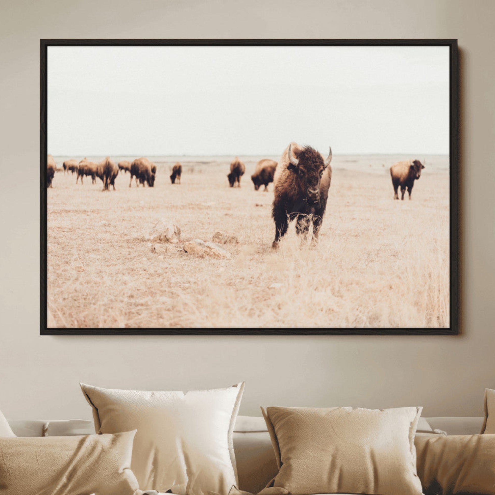 Herd of bison roaming a vast prairie with golden grass under a soft sky, creating a rustic and Western landscape, ideal for wall art.