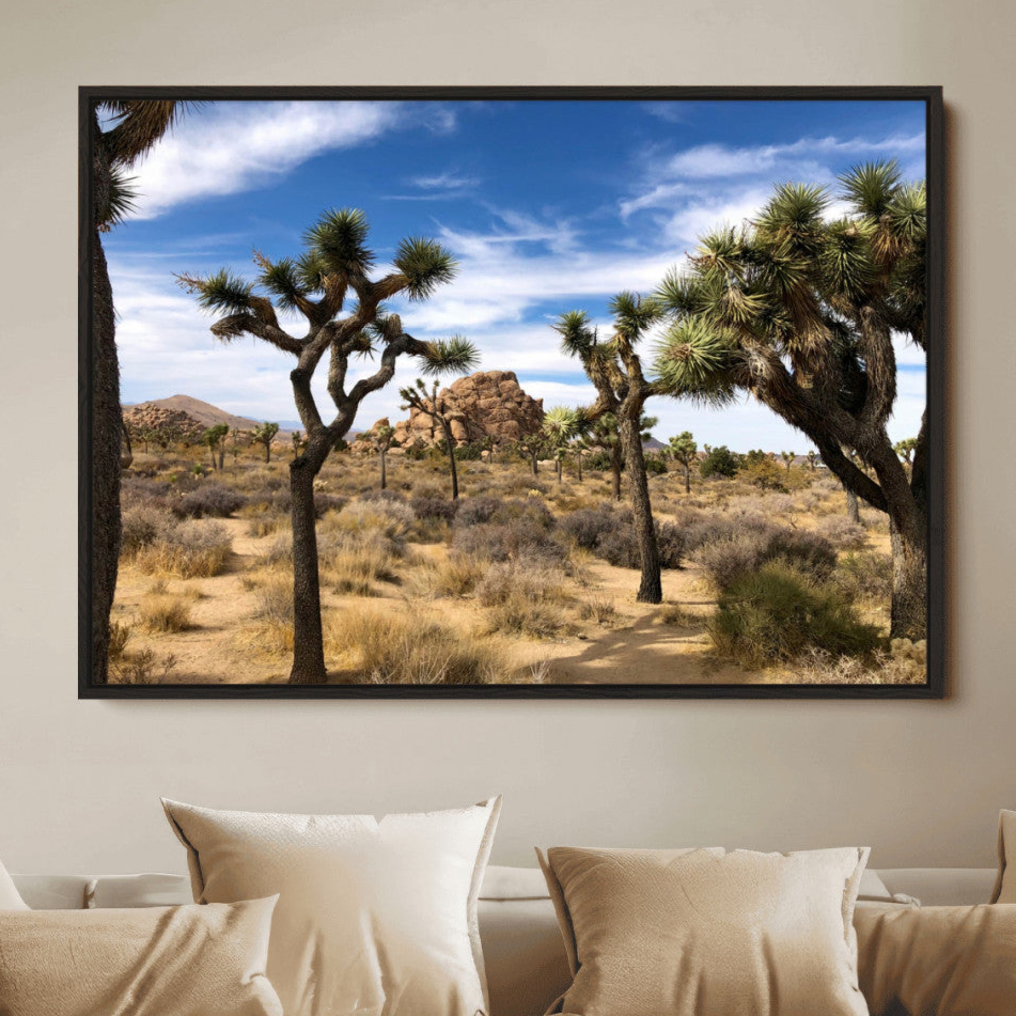 Scenic Joshua Tree landscape with rugged desert terrain, golden dry grass, and a deep blue sky, creating a warm, rustic Southwestern aesthetic.
