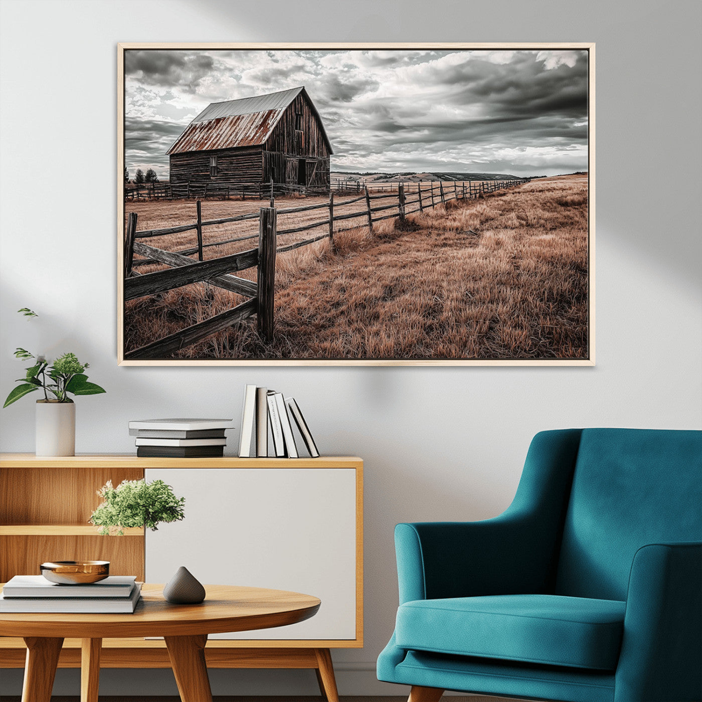 "Black-and-white photograph of a rustic barn with a weathered roof, surrounded by a wooden fence and vast golden fields under a moody sky."