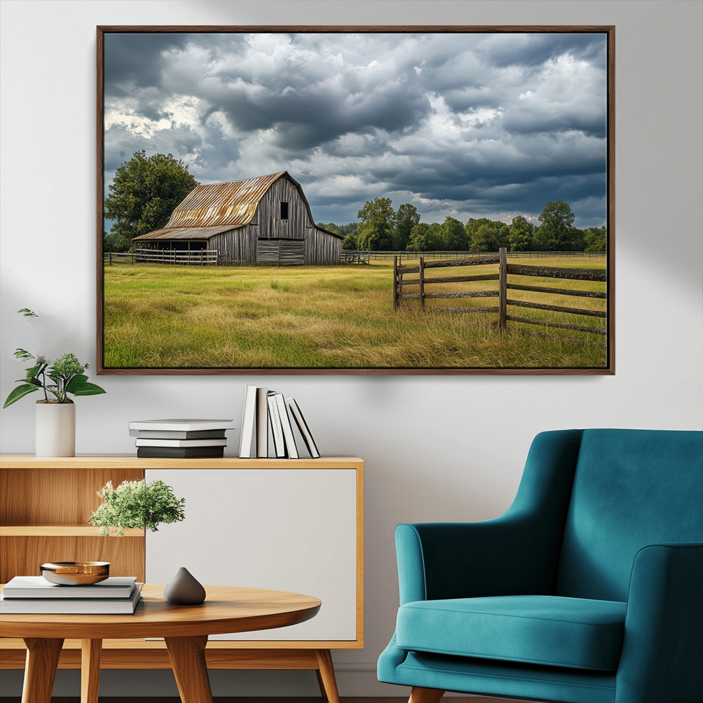 "Rustic barn in a wide open field under a dramatic sky with dark clouds, surrounded by a wooden fence and lush green trees."